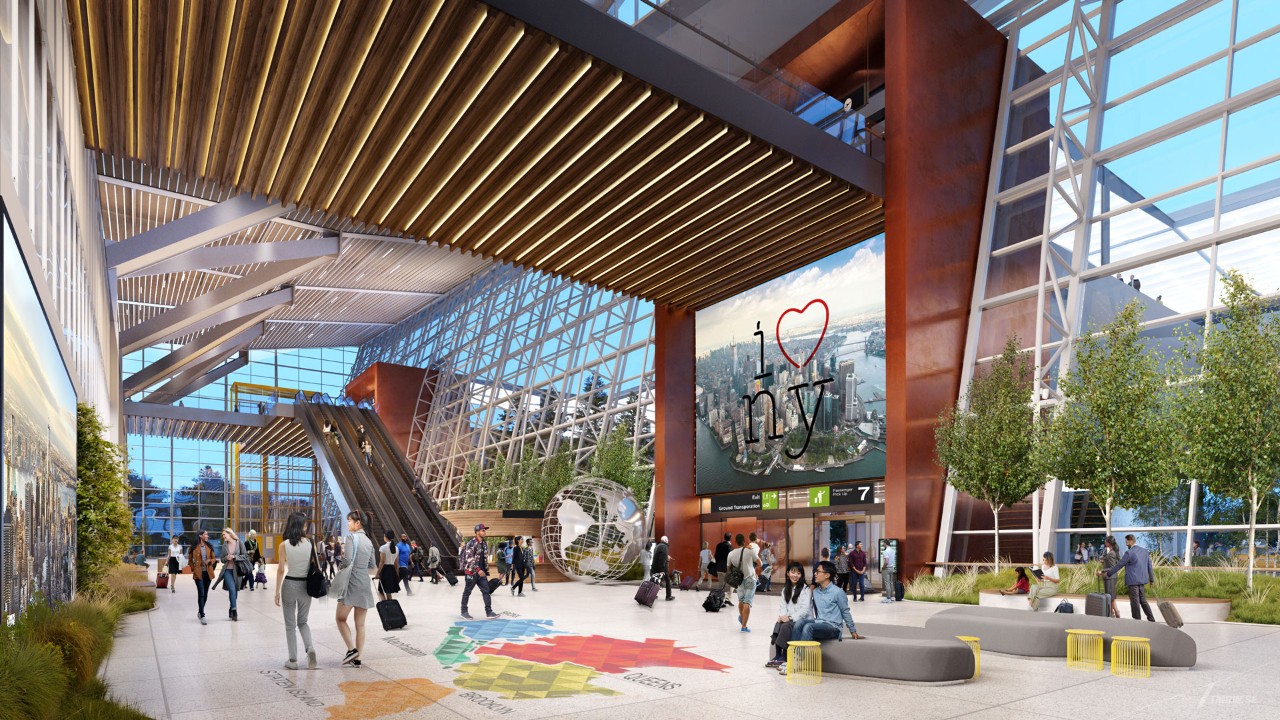 A modern airport terminal interior featuring a large 'I ♥ NY' sign, travelers moving about, and lush greenery.