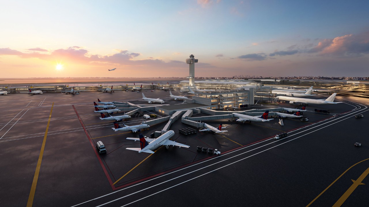 A bustling airport scene at sunset, featuring multiple aircraft and a control tower.
