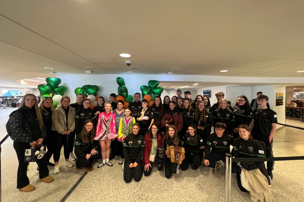 A group of people smiling to celebrate St. Patrick's Day at Terminal 7